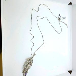 Torrid long necklace with silver rhinestone leaf pendant